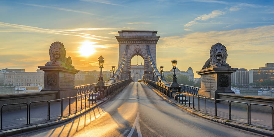 The sun rises over Budapest’s chain bridge